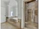 Spa-like bathroom with a soaking tub and glass-enclosed shower at 400 Bay Crossing Rd, Mount Pleasant, SC 29464