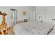 Cozy bedroom with a double bed, adjacent bathroom access, and hardwood floors at 400 Bay Crossing Rd, Mount Pleasant, SC 29464