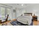 Comfortable bedroom with a queen-size bed, french doors and hardwood floors at 400 Bay Crossing Rd, Mount Pleasant, SC 29464