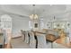 Bright dining area with wooden table and chairs, opens to living room at 400 Bay Crossing Rd, Mount Pleasant, SC 29464