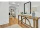 Elegant entry hall with hardwood floors, a console table and a mirror at 400 Bay Crossing Rd, Mount Pleasant, SC 29464