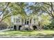 Two story house with a large front porch, palm trees, and manicured lawn at 400 Bay Crossing Rd, Mount Pleasant, SC 29464