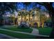 Two-story house beautifully lit at night with a landscaped yard at 400 Bay Crossing Rd, Mount Pleasant, SC 29464