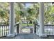 Elegant front porch with white columns and a view of the street at 400 Bay Crossing Rd, Mount Pleasant, SC 29464