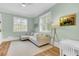 Light-filled Gathering room with built-in shelving and a comfortable sectional at 400 Bay Crossing Rd, Mount Pleasant, SC 29464