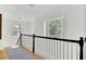Bright hallway with hardwood floors and a view of a window and staircase at 400 Bay Crossing Rd, Mount Pleasant, SC 29464