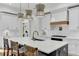 Updated kitchen with white cabinetry, wood range hood and breakfast bar at 400 Bay Crossing Rd, Mount Pleasant, SC 29464