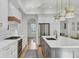 Stylish kitchen features white cabinets, a large island, and hardwood floors at 400 Bay Crossing Rd, Mount Pleasant, SC 29464