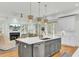 Modern kitchen with large island, white cabinets, and stainless steel appliances at 400 Bay Crossing Rd, Mount Pleasant, SC 29464