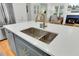 Kitchen island with a farmhouse sink and a gold faucet at 400 Bay Crossing Rd, Mount Pleasant, SC 29464