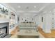 Open concept living room with hardwood floors and built-in shelving at 400 Bay Crossing Rd, Mount Pleasant, SC 29464