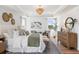 Main bedroom with hardwood floors, large windows and sitting area at 472 White Magnolia St, Moncks Corner, SC 29461