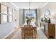Dining room with wood table and chairs, and a view to backyard at 472 White Magnolia St, Moncks Corner, SC 29461