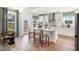 Modern kitchen with white cabinets, island, and stainless steel appliances at 472 White Magnolia St, Moncks Corner, SC 29461