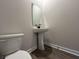 Powder room featuring a sleek pedestal sink, mirror and fixtures at 5134 Double Eagle, Summerville, SC 29485