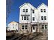 Three-story townhome with white siding and brick accents at 5134 Double Eagle, Summerville, SC 29485