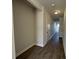 Hallway with wood floors that lead into an open layout perfect for easy navigation between rooms at 5134 Double Eagle, Summerville, SC 29485