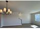 Bright living room with hardwood floors, chandelier, and staircase, creating a modern and inviting space at 5134 Double Eagle, Summerville, SC 29485