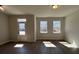 Bright living room with hardwood floors, a glass door, and large windows that provide abundant natural light at 5134 Double Eagle, Summerville, SC 29485