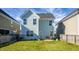 Large backyard with a view of the home's exterior and surrounding houses at 563 Alderly Dr, Moncks Corner, SC 29461
