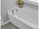 White bathtub with silver fixtures in a well-lit bathroom at 563 Alderly Dr, Moncks Corner, SC 29461