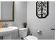 Small bathroom with pedestal sink and decorative wall art at 563 Alderly Dr, Moncks Corner, SC 29461