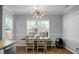 Dining area with wood table, chairs, and a large window at 563 Alderly Dr, Moncks Corner, SC 29461