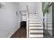 Bright entryway with hardwood floors and a staircase leading upstairs at 563 Alderly Dr, Moncks Corner, SC 29461