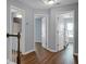 Upstairs hallway with doors to bedrooms and bathroom, hardwood floors at 563 Alderly Dr, Moncks Corner, SC 29461