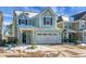 Beautiful two-story light blue house with a two-car garage at 563 Alderly Dr, Moncks Corner, SC 29461