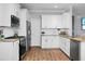 Bright kitchen with white cabinets, granite counters, and stainless steel appliances at 563 Alderly Dr, Moncks Corner, SC 29461