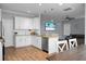 Open concept kitchen with island and stainless steel appliances at 563 Alderly Dr, Moncks Corner, SC 29461
