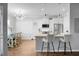 Modern kitchen with white cabinets, stainless steel appliances, and breakfast bar at 563 Alderly Dr, Moncks Corner, SC 29461