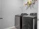 Laundry room with washer, dryer, and shelving for storage at 563 Alderly Dr, Moncks Corner, SC 29461