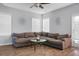 Living Room with gray sectional sofa, hardwood floors, and ceiling fan at 563 Alderly Dr, Moncks Corner, SC 29461