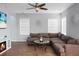 Living room with sectional sofa, electric fireplace, and large TV at 563 Alderly Dr, Moncks Corner, SC 29461