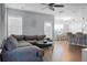 Open concept living room and kitchen with hardwood floors and a gray sectional sofa at 563 Alderly Dr, Moncks Corner, SC 29461