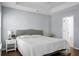 Main bedroom with king-size bed, nightstand, and access to bathroom at 563 Alderly Dr, Moncks Corner, SC 29461