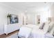 Relaxing bedroom with white bedding, dresser, and large art piece at 748 Maynard Ln, Summerville, SC 29486
