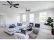 Cozy bonus room with sectional sofa, two chairs, and a coffee table at 748 Maynard Ln, Summerville, SC 29486