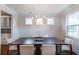 Elegant dining room featuring a wooden table, chandelier, and built-in hutch at 748 Maynard Ln, Summerville, SC 29486