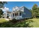 Two-story house with gray siding, a metal roof, and a side yard at 748 Maynard Ln, Summerville, SC 29486