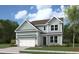 Two-story house with light green siding and a two-car garage at 748 Maynard Ln, Summerville, SC 29486