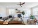 Relaxing living room featuring hardwood floors, a fireplace, and ample natural light at 748 Maynard Ln, Summerville, SC 29486