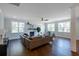 Spacious living room with hardwood floors, fireplace, and large windows at 748 Maynard Ln, Summerville, SC 29486