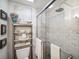Clean bathroom with a glass shower door and marble-style tile at 12 Bee Street St # A, Charleston, SC 29403