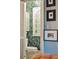 Tropical-themed bathroom with a toilet and decorative wallpaper at 12 Bee Street St # A, Charleston, SC 29403
