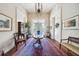 Spacious entryway with hardwood floors, antique furniture, and high ceilings at 12 Bee Street St # A, Charleston, SC 29403