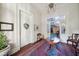 Bright entryway with hardwood floors and antique furniture at 12 Bee Street St # A, Charleston, SC 29403