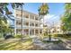 Grand two-story brick home with a fountain and lush landscaping at 12 Bee Street St # A, Charleston, SC 29403